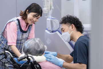 Fototapeta premium Dental treatment of an elderly person in a wheelchair Image of oral care for the elderly