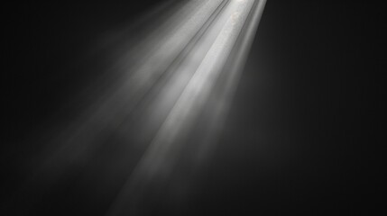 Rays of light shining through a dark background creating a dramatic and ethereal effect