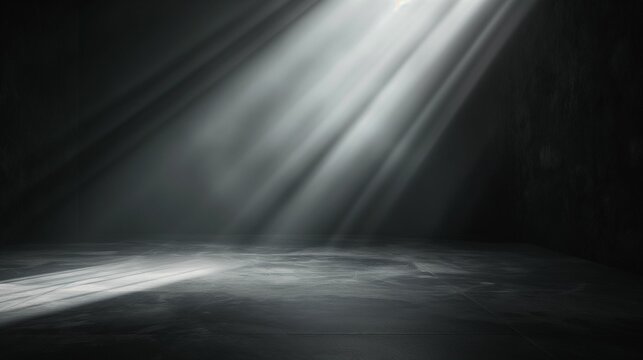 Rays of light shining through a dark background creating a dramatic and ethereal effect