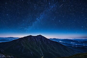 mountaintop. A vast starry sky stretches above, filled with twinkling stars and constellations