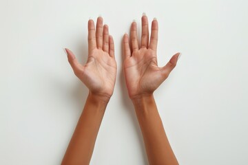Two hands are raised in the air, one of which is slightly bent