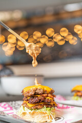 Spreading sauce on the cheeseburger bun in the restaurant