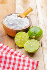 Baking soda and lime on a wooden surface