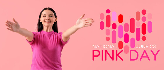 Young woman smiling on pink background