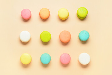 Sweet macaroons on orange background