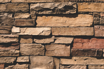 textured sandstone wall
