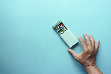 top view of medical pills in a pill box on table 