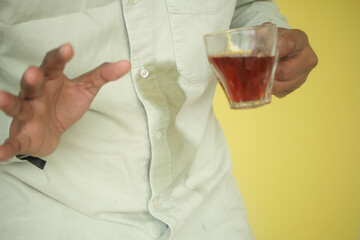  men hands with spilled coffee over his shirt
