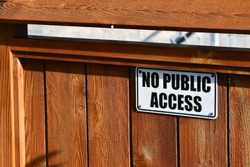 No public access sign on wooden gate.
