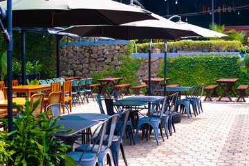 tables and benches in the outdoor cafe