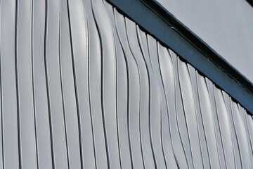 Water damaged siding, Extreme warpage of panels.