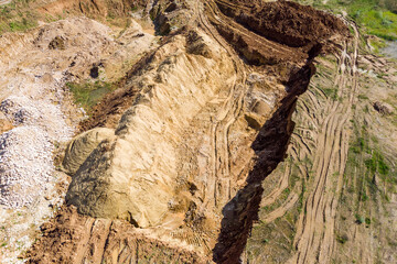 Top view of a pit dug by excavators in the ground