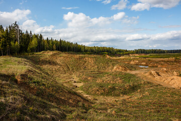 Naklejka premium Landscape of an overgrown sand quarry after mining