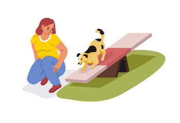 Woman Training Dog On Agility Seesaw
