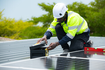  Technician inspects solar panel installation and test the operation of the panel