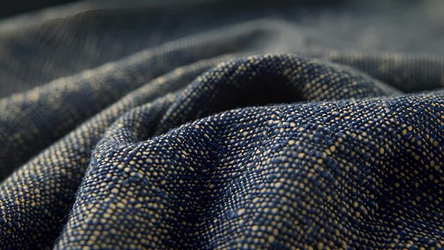 The denim features a subtle pebbled texture with tiny raised bumps tered across the surface for a tactile feel and visual interest.