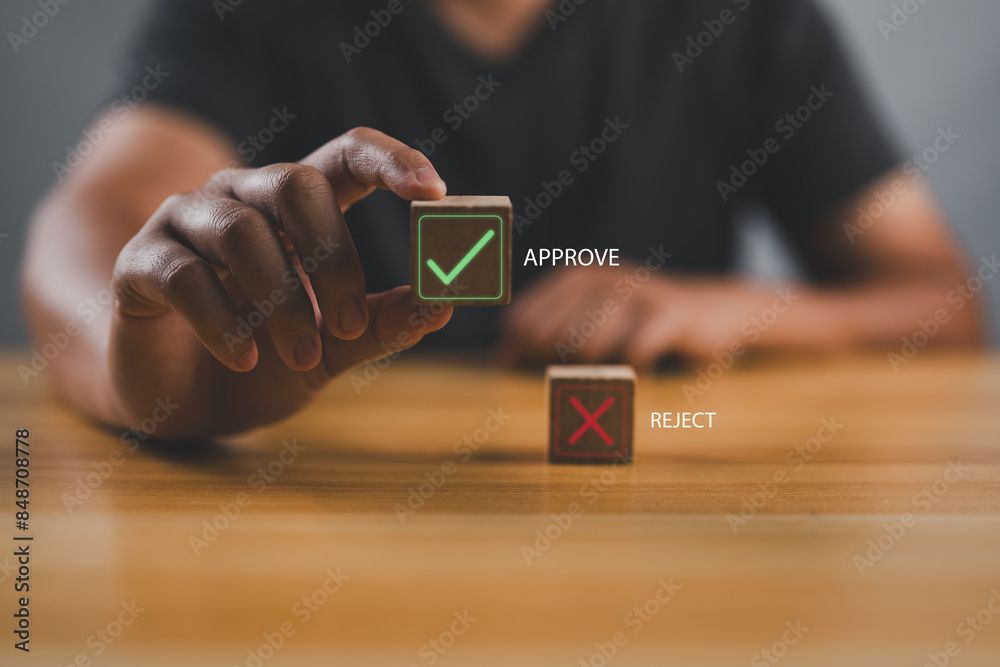 Poster businessman's hand chooses the one wooden cube block with the green right for approve and reject bus