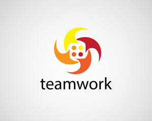 creative four people gathered together holding hands in a circle shaped like a rotating propeller logo