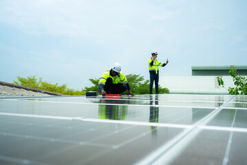 Engineer and technician inspects solar panel installation and test the operation of the panel