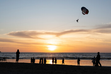 parasailing,wartersport activity.silhuuette shot.