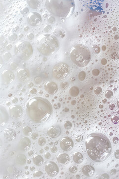 Lathered white soap suds and bubbles background