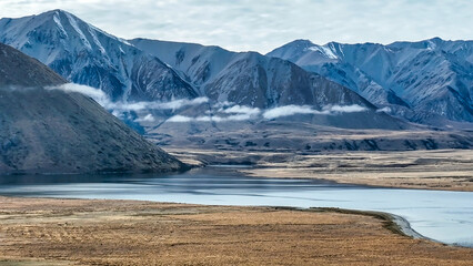 Drone perspective of the countryside around the shore of an alpine Lake Heron in Hakatere conservation area