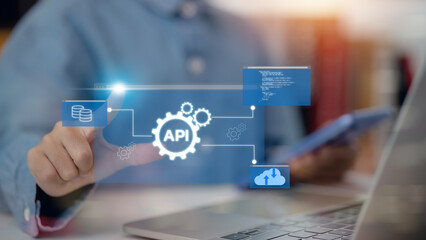 API concept. Women interacts with the virtual screen API icon, a vital software development tool