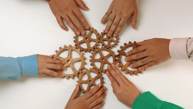Panorama video of wooden cogwheel gear separate each other symbolize share the work function productive system in business company and synergy teamwork with effective and efficiency working. Synergic