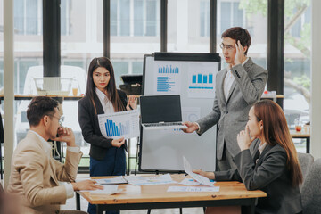 business related meeting Asian Business Team Discusses Strategy for Starting a Financial Process Analysis Project Successful Asian businessman working on a plan