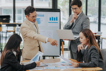 business related meeting Asian Business Team Discusses Strategy for Starting a Financial Process Analysis Project Successful Asian businessman working on a plan