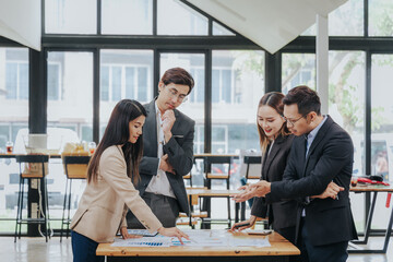 business related meeting Asian Business Team Discusses Strategy for Starting a Financial Process Analysis Project Successful Asian businessman working on a plan
