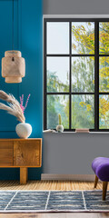 Modern interior design living room composition with a sideboard next to a window filling the room with natural lighting. Modern home decor concept image.