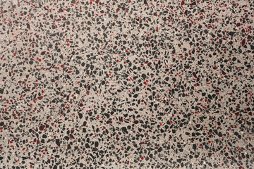Sol en terrazzo gris avec éclats rouges