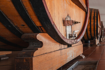 Wooden Barrels in a Winery Cellar