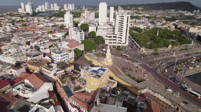 Aerial Drone Flyover Cartagena City And Historical Landmark Torre Del Reloj Monument, Colombia