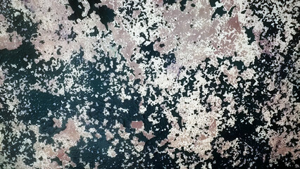 Texture of old grunge cracked paint on a gray wall.