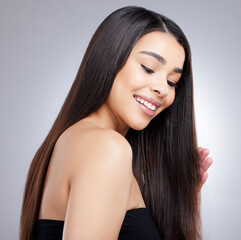 Fototapeta premium Portrait, happy and woman with hair beauty in studio for healthy growth, keratin treatment or straight hairstyle aesthetic. Female person, wellness and collagen shine, cosmetics and white background