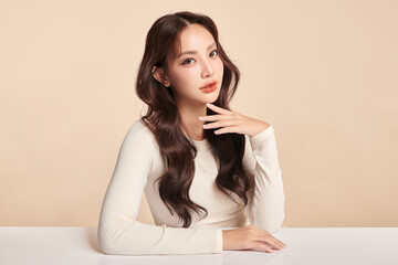 Obraz premium Beautiful young asian woman with clean fresh skin on beige background, Face care, Facial treatment, Cosmetology, beauty and spa, Asian women portrait.