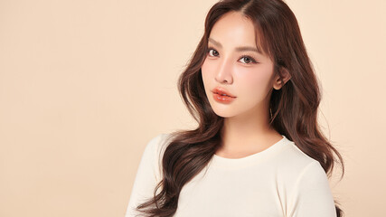 Fototapeta premium Beautiful young asian woman with clean fresh skin on beige background, Face care, Facial treatment, Cosmetology, beauty and spa, Asian women portrait.