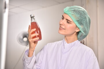 QC manager inspecting the quality of a beverage product in the production process