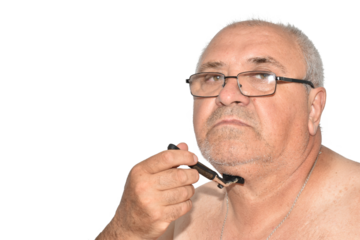 A man tries to shave his neck with a machine.