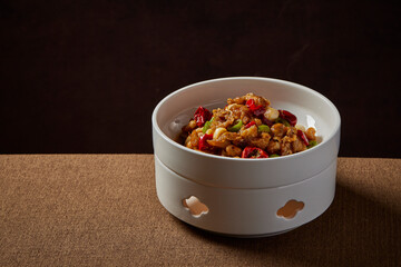 traditional chinese wok fried seafood fresh frog chicken meat with spicy chilli sauce in plate on brown stone table asian cafe hotel luxury halal food restaurant banquet menu