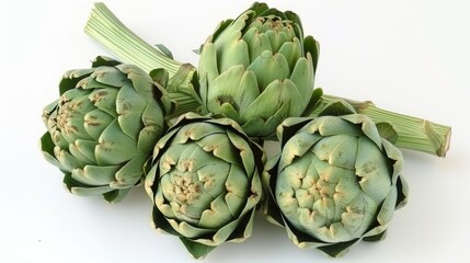 Obraz premium Artichoke vegetables picked from a garden against a white backdrop