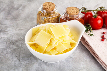 Sliced parmesan cheese in the bowl