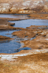 Hot springs, pools full of cooking blue mud on Hverir on iceland