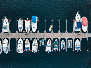 Aerial view of boats jet ski in dock in summer Finland. Colorful landscape with sailboats and...