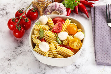 Italian pasta with mozzarella and tomato
