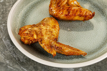 Tasty roasted chicken wing with spices