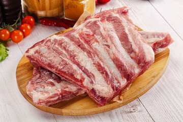 Raw pork ribs over board