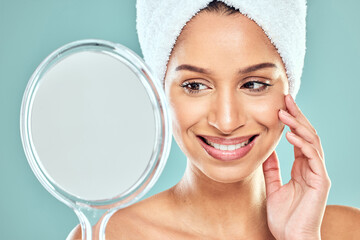 Happy woman, towel and beauty with mirror in studio for wellness, health or face treatment. Female...